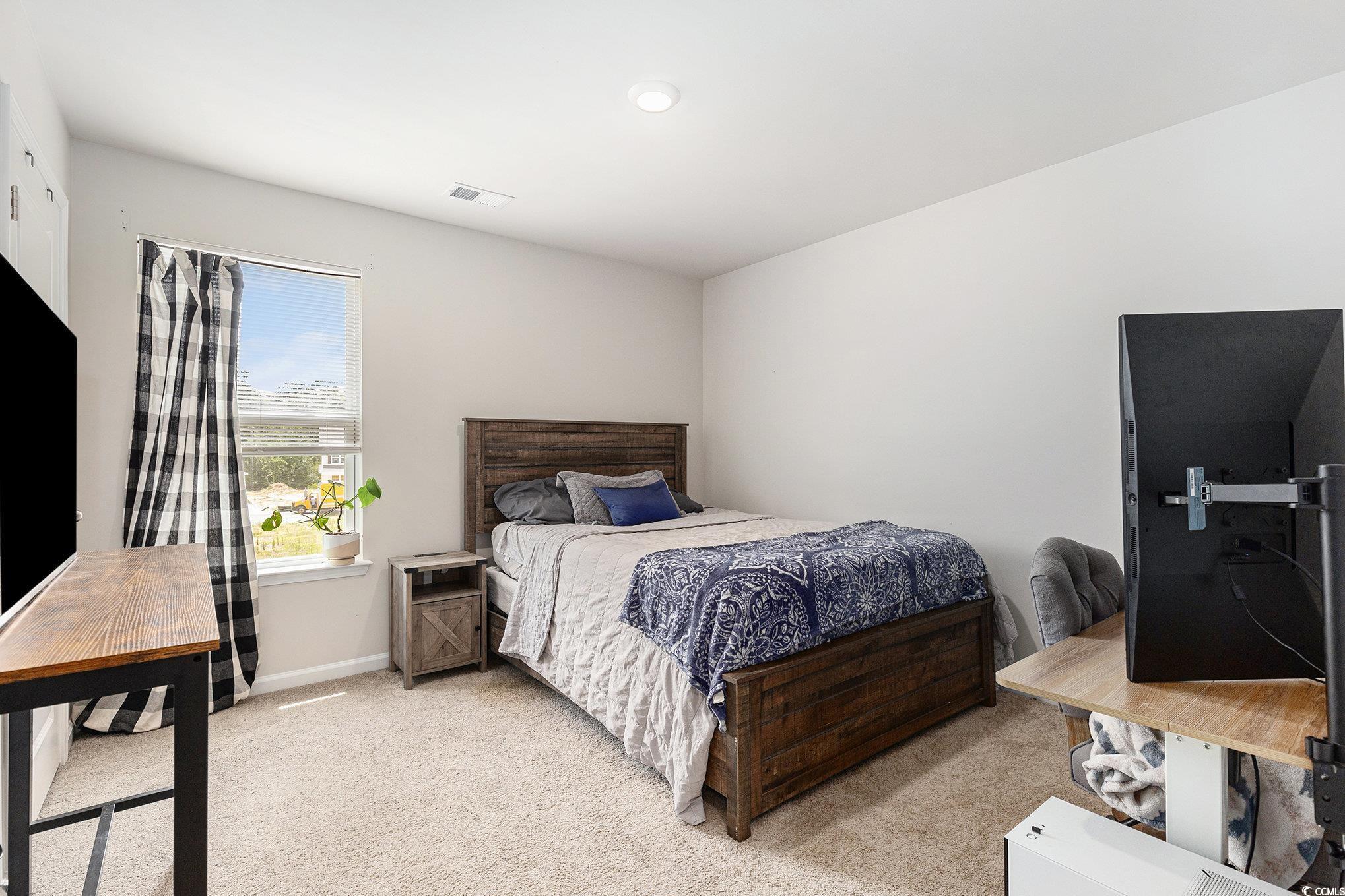 651 Choctaw Drive Conway, SC 29526 - Photo 16 of 37 Bedroom with light colored carpet and a desk