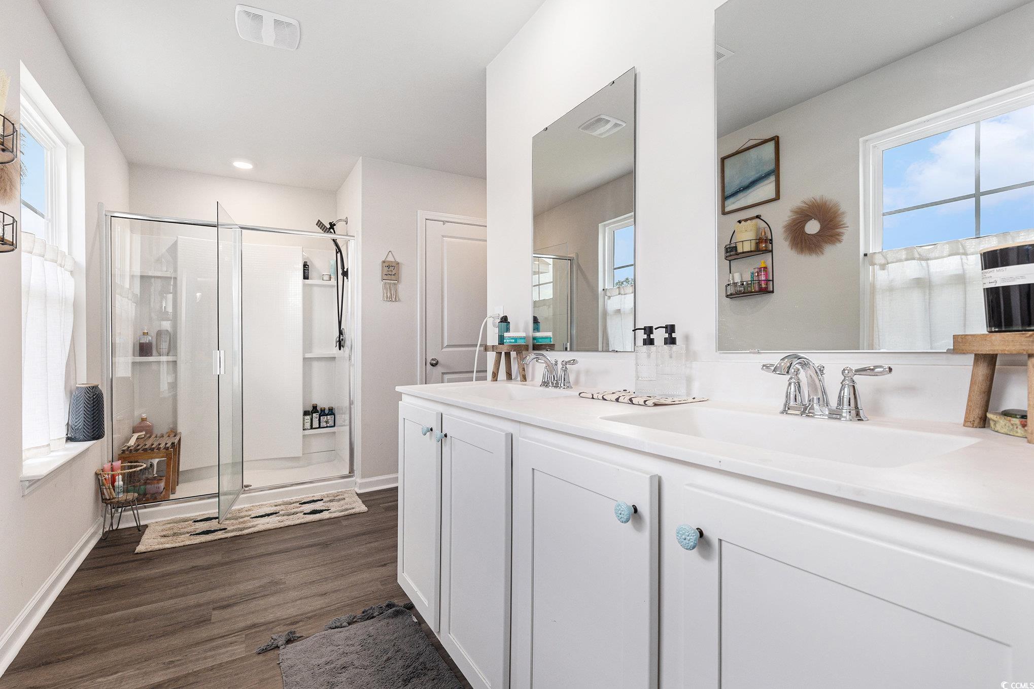 651 Choctaw Drive Conway, SC 29526 - Photo 21 of 37 Full bathroom with a shower stall, double vanity, and dark wood-style floors