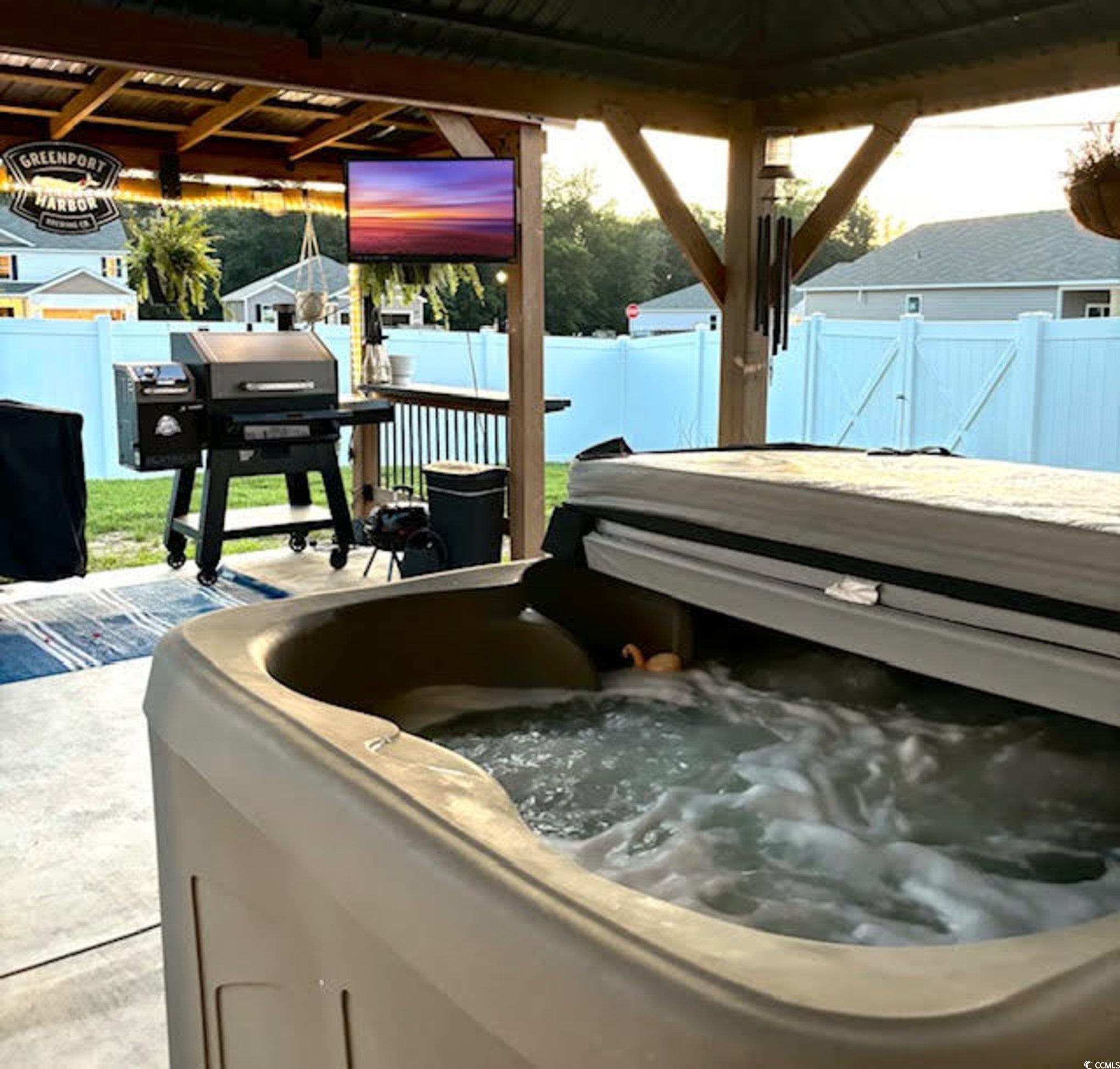 651 Choctaw Drive Conway, SC 29526 - Photo 26 of 37 Fenced backyard with a hot tub and area for grilling