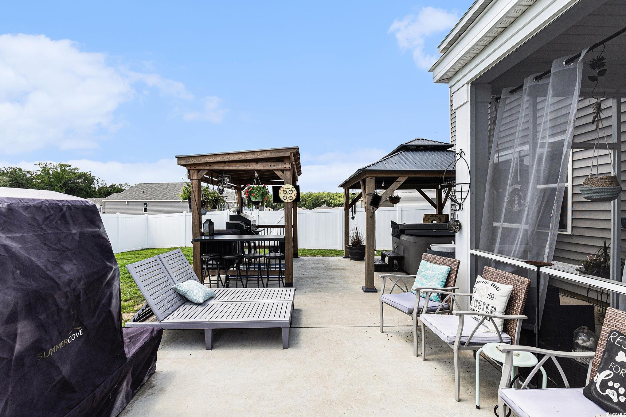 651 Choctaw Drive Conway, SC 29526 - Photo 27 of 37 Fenced backyard with a gazebo, a patio area, and a grill