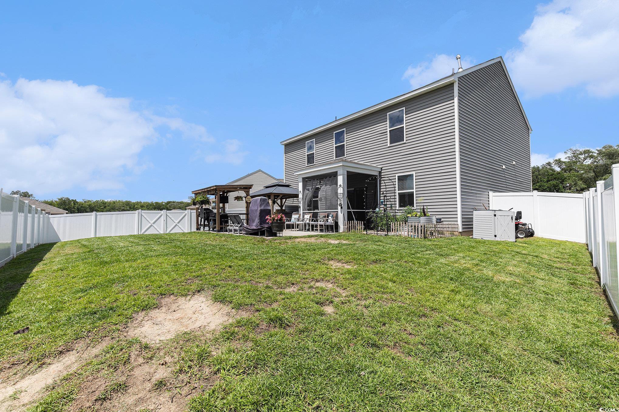 651 Choctaw Drive Conway, SC 29526 - Photo 34 of 37 Back of property with a gazebo and a fenced backyard