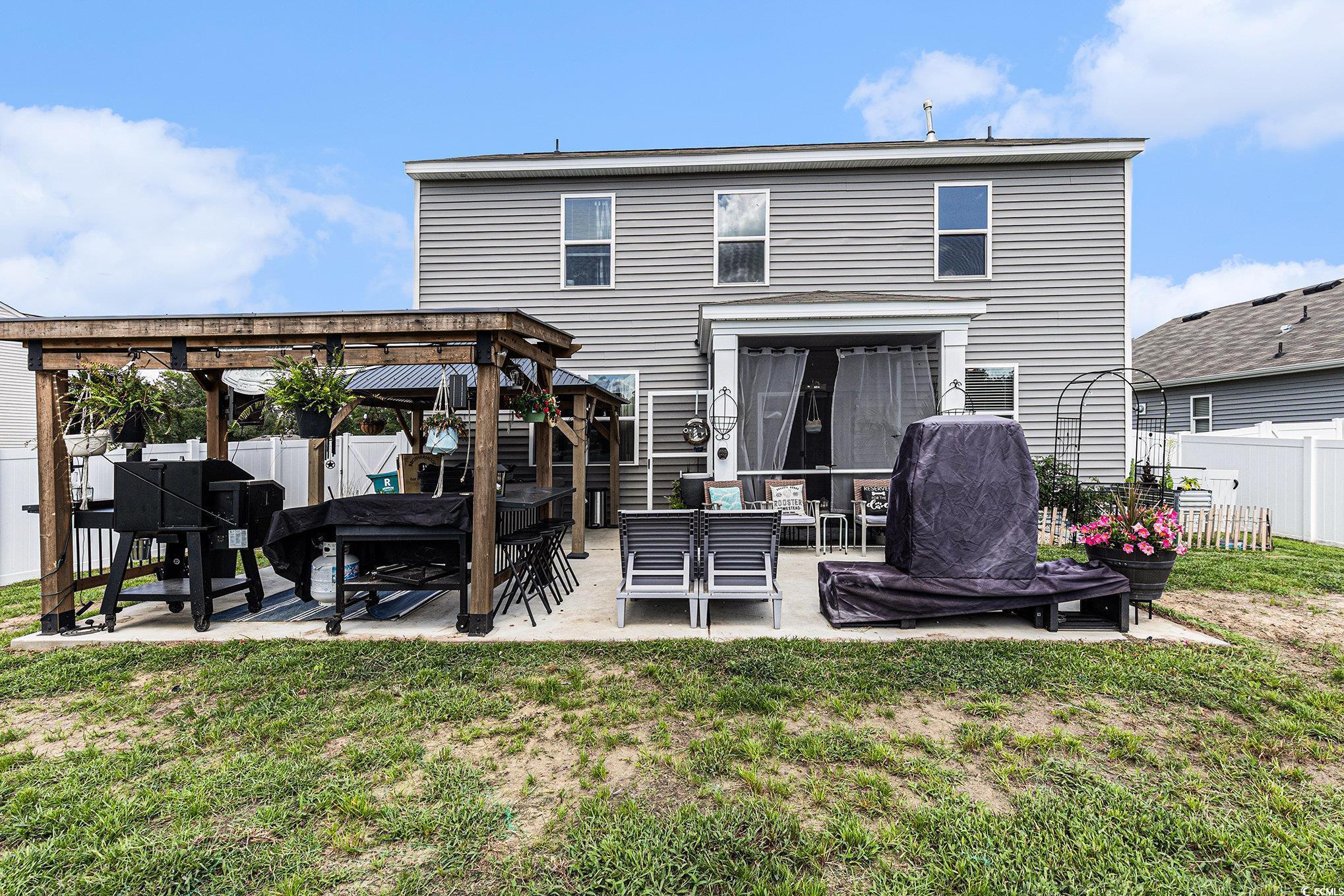 651 Choctaw Drive Conway, SC 29526 - Photo 35 of 37 Rear view of house with a patio, a fenced backyard, a gazebo, and outdoor lounge area
