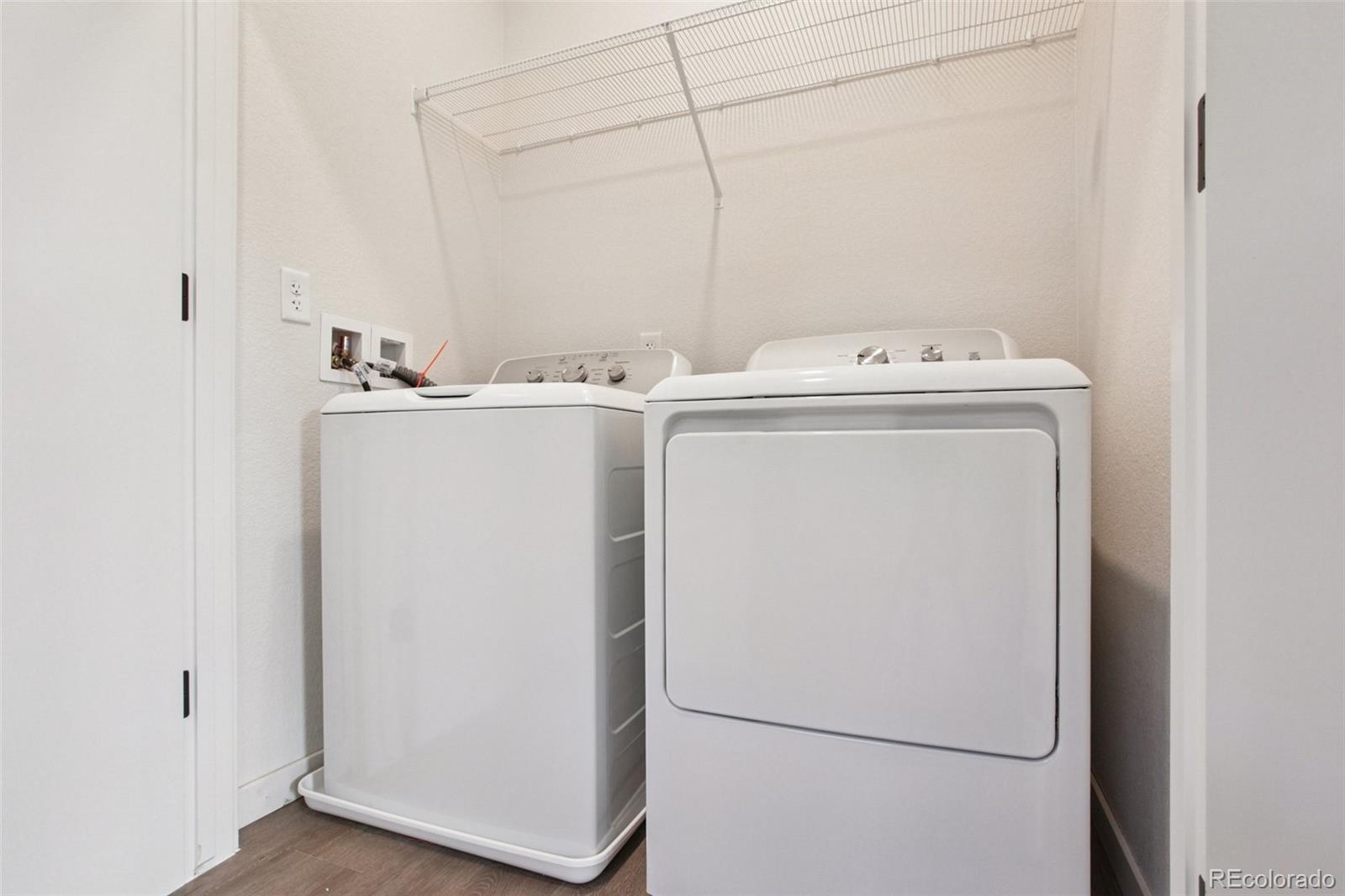 6419 Meade Way Arvada, CO 80003 - Photo 16 of 29 a utility room with dryer and washer