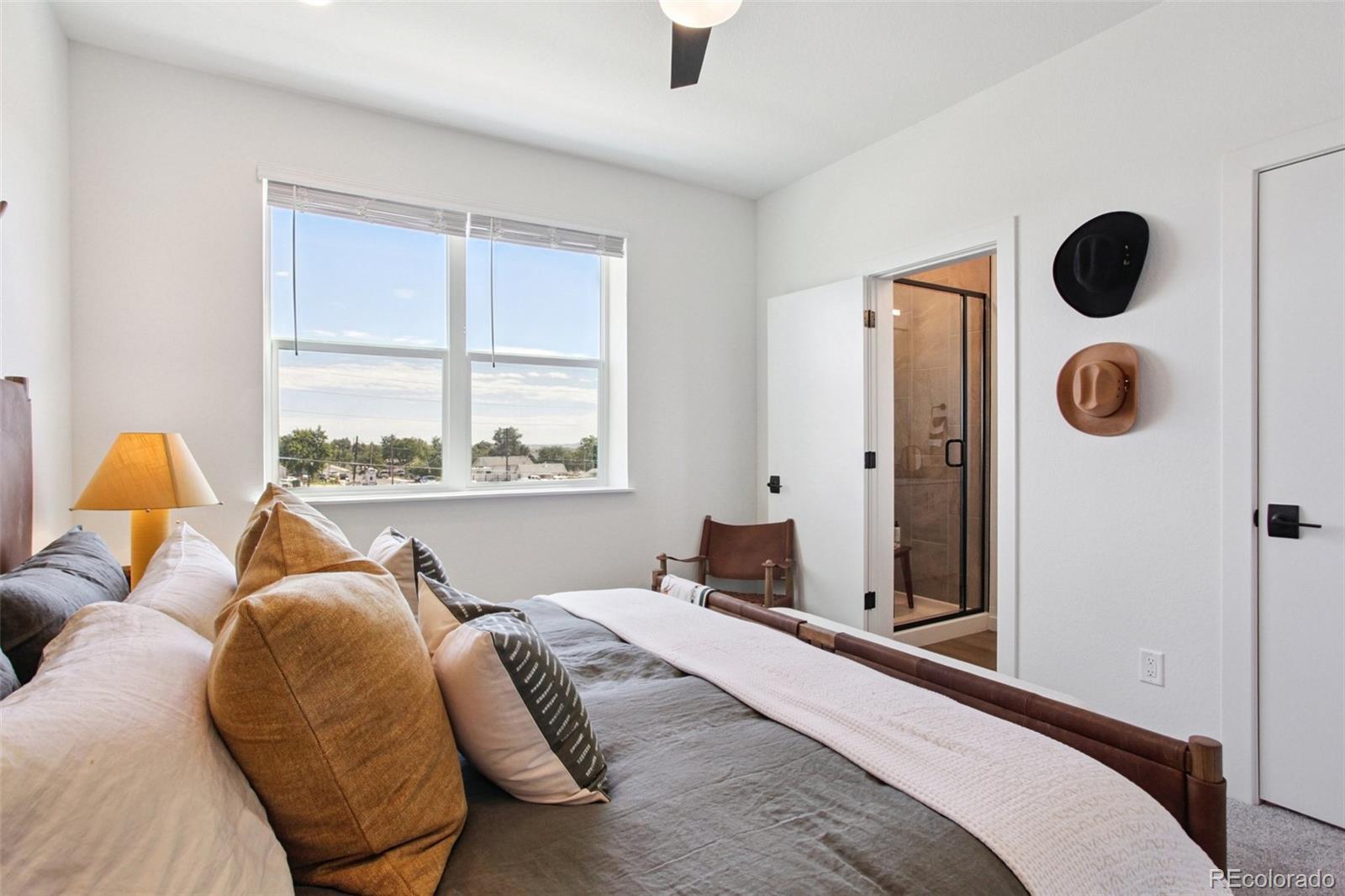6419 Meade Way Arvada, CO 80003 - Photo 6 of 29 a bedroom with a bed and window