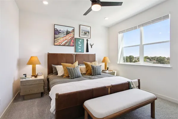 a bedroom with a bed and window