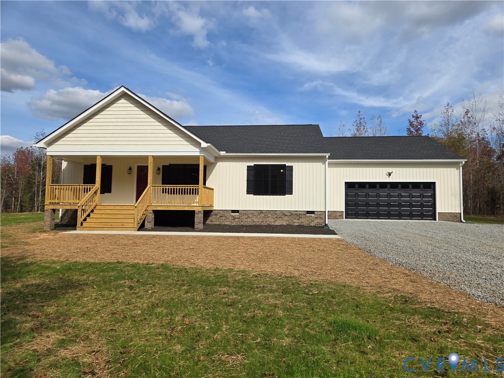 1775 Bumpass Road Bumpass, VA 23024 - Photo 1 of 42 a view of a house with backyard and a garage