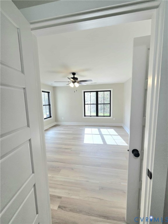 1775 Bumpass Road Bumpass, VA 23024 - Photo 14 of 42 a view of empty room with wooden floor and fan