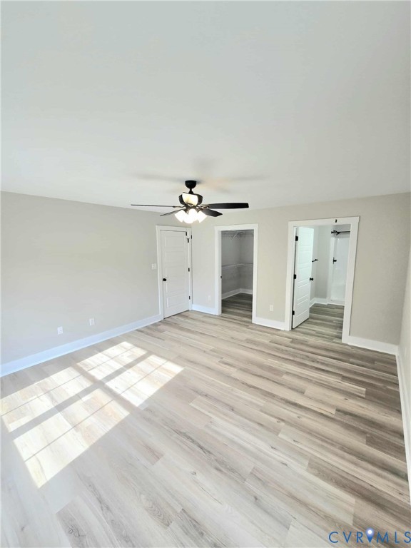 1775 Bumpass Road Bumpass, VA 23024 - Photo 15 of 42 a view of a livingroom with wooden floor and a ceiling fan