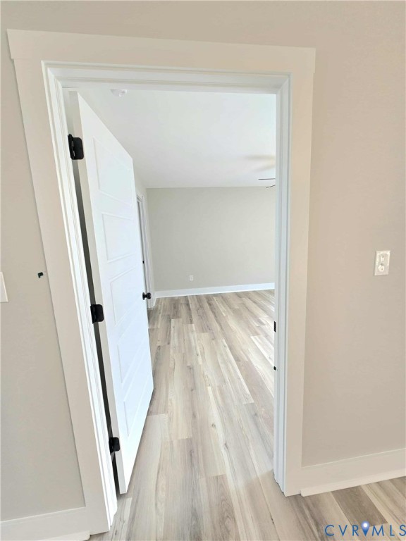 1775 Bumpass Road Bumpass, VA 23024 - Photo 18 of 42 a view of a hallway with wooden floor and staircase