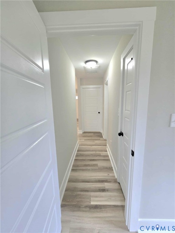 1775 Bumpass Road Bumpass, VA 23024 - Photo 19 of 42 a view of a hallway with wooden floor and staircase