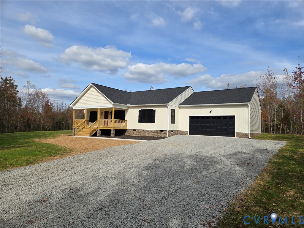 1775 Bumpass Road Bumpass, VA 23024 - Photo 2 of 42 a front view of a house with a yard and garage