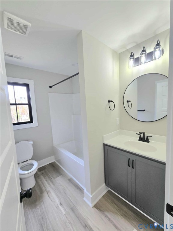 1775 Bumpass Road Bumpass, VA 23024 - Photo 21 of 42 a bathroom with a toilet a sink and mirror