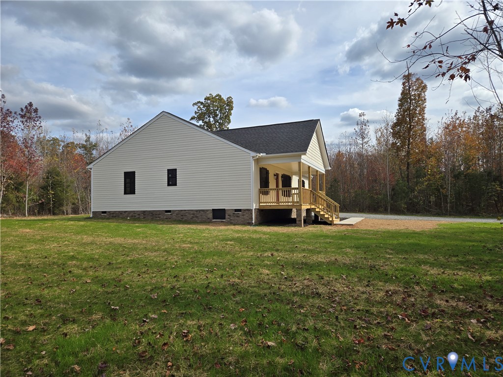 1775 Bumpass Road Bumpass, VA 23024 - Photo 5 of 42 a view of a house with a big yard and a large tree