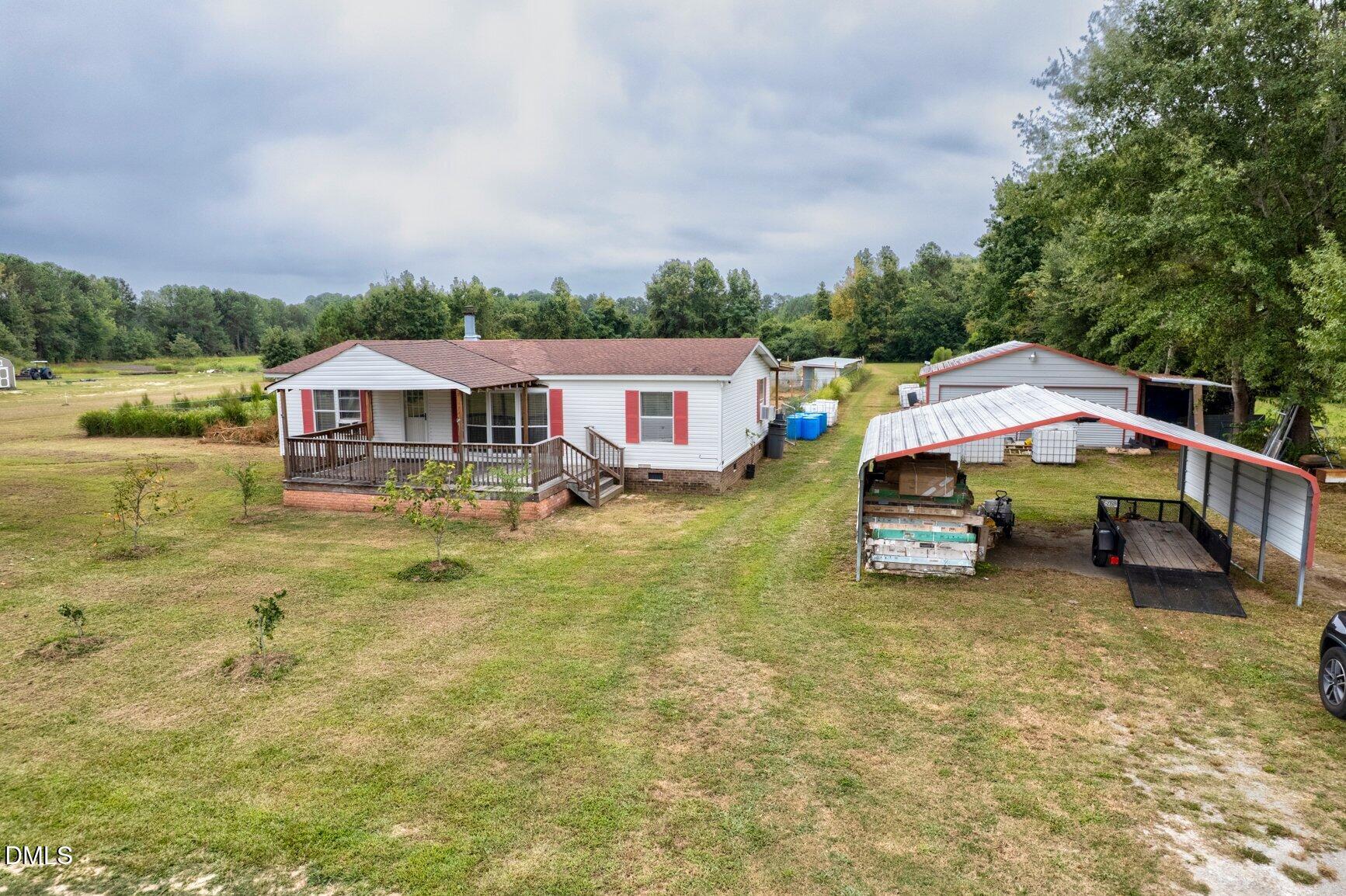 1835 Cokey Road Rocky Mount, NC 27801 - Photo 31 of 42 a aerial view of a house with swimming pool and lake view