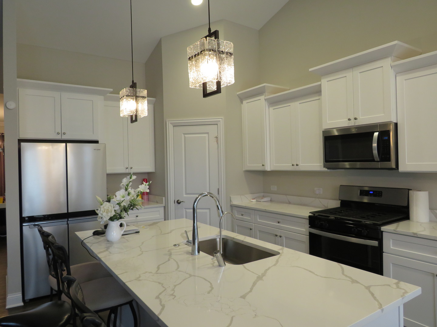 21407 Bay Tree Court Shorewood, IL 60404 - Photo 19 of 53 a kitchen with granite countertop a sink stainless steel appliances and cabinets