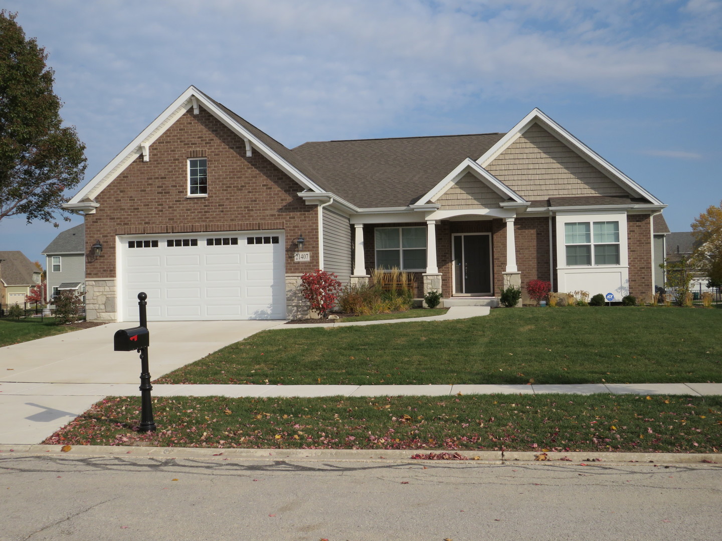 21407 Bay Tree Court Shorewood, IL 60404 - Photo 2 of 53 a front view of a house with a yard