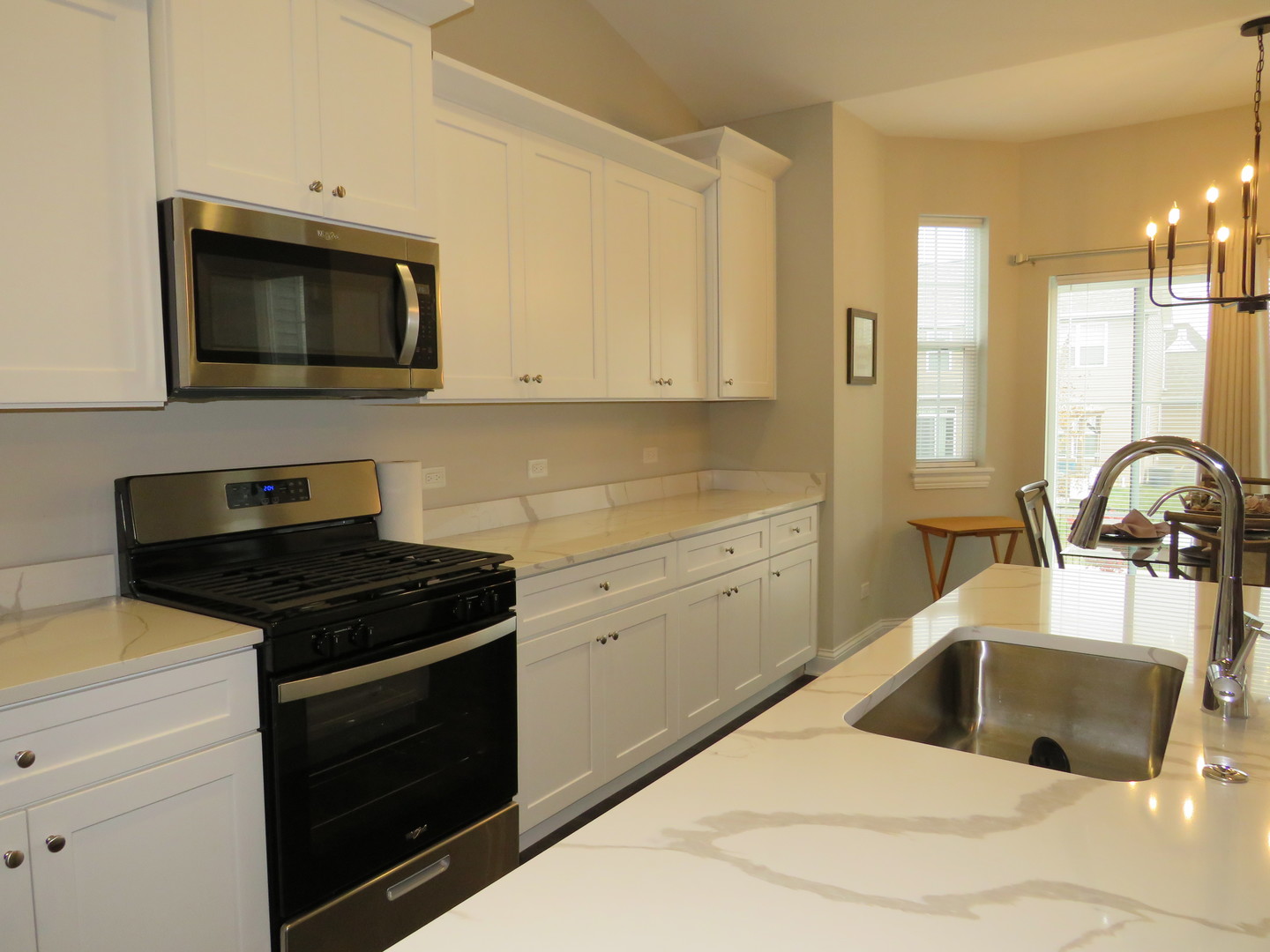21407 Bay Tree Court Shorewood, IL 60404 - Photo 22 of 53 a kitchen with a stove and a sink