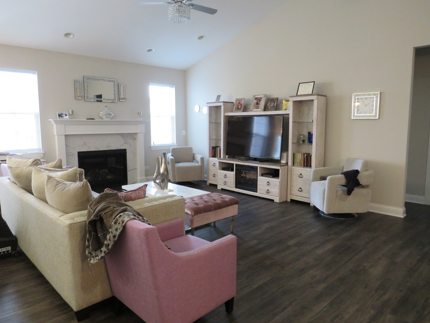 21407 Bay Tree Court Shorewood, IL 60404 - Photo 24 of 53 a living room with furniture a flat screen tv and a fireplace