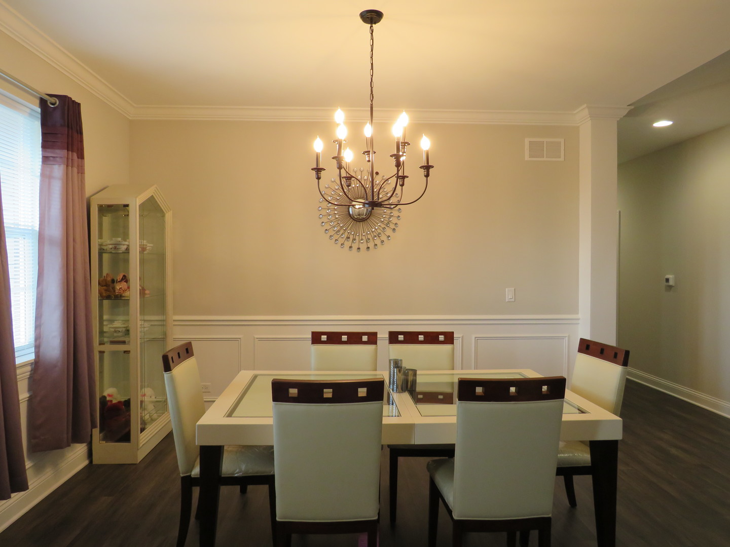 21407 Bay Tree Court Shorewood, IL 60404 - Photo 28 of 53 a view of a dining room with furniture and chandelier