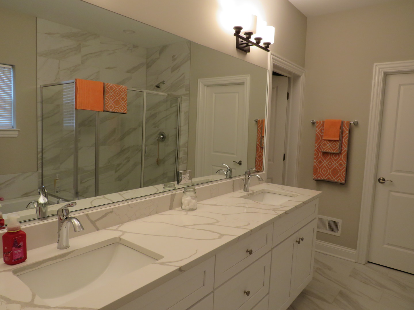 21407 Bay Tree Court Shorewood, IL 60404 - Photo 32 of 53 a bathroom with a granite countertop sink and a mirror