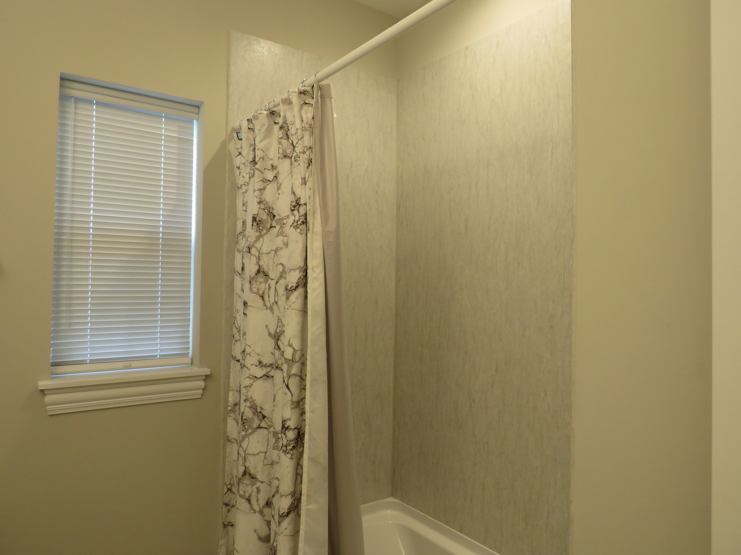 21407 Bay Tree Court Shorewood, IL 60404 - Photo 38 of 53 a bathroom with a shower curtain and a window