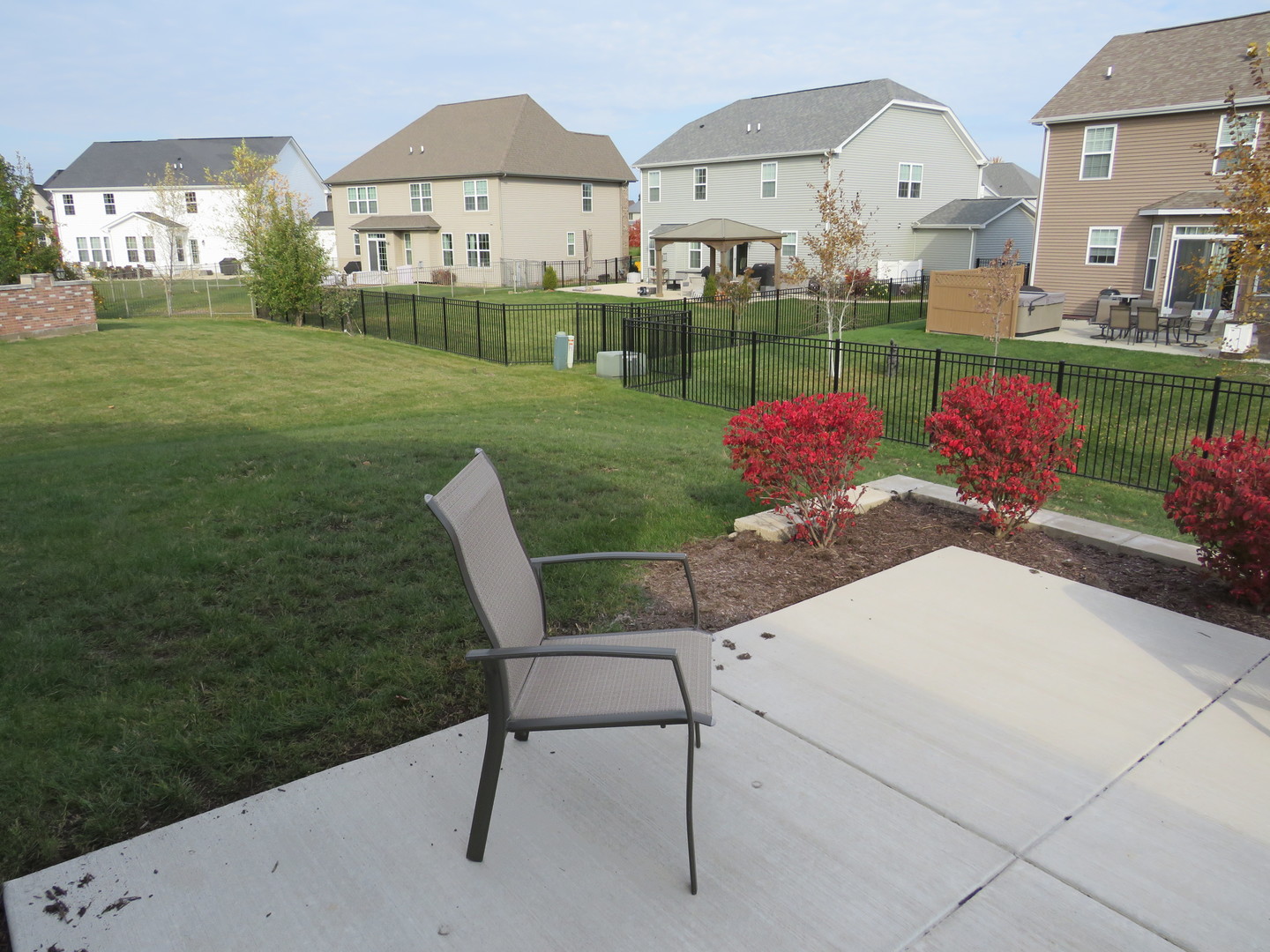 21407 Bay Tree Court Shorewood, IL 60404 - Photo 10 of 53 a view of a backyard with table and chairs potted plants