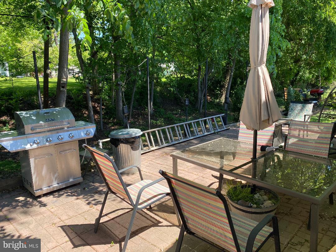 14 Thomas Lane Sparrows Point, MD 21219 - Photo 7 of 26 a view of a chairs and table in backyard