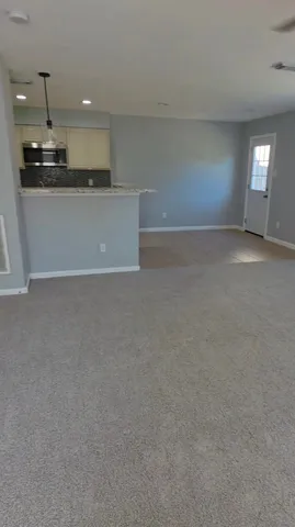 a view of a kitchen and a window