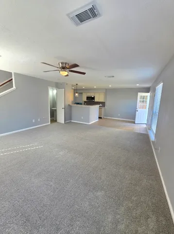 a view of a livingroom with a ceiling fan