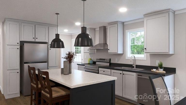 520 Eagle Mills Road Hamptonville, NC 27020 - Photo 5 of 14 a kitchen with stainless steel appliances a sink a stove a refrigerator a dining table and chairs