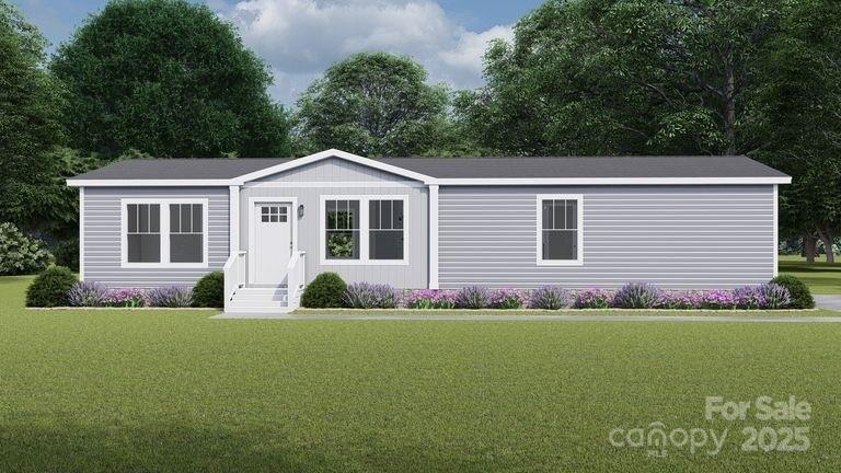 520 Eagle Mills Road Hamptonville, NC 27020 - Photo 9 of 14 a front view of a house with a yard