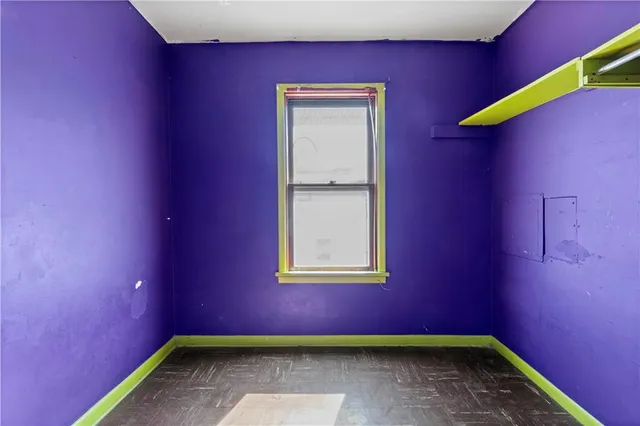 a view of a big room with windows