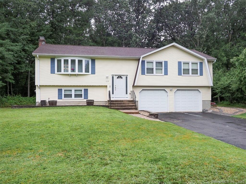 110 Brookview Road Windsor, CT 06095 - Photo 1 of 1 a front view of a house with a garden and yard