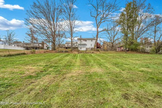 a view of an entryway with wooden floor and stairs
