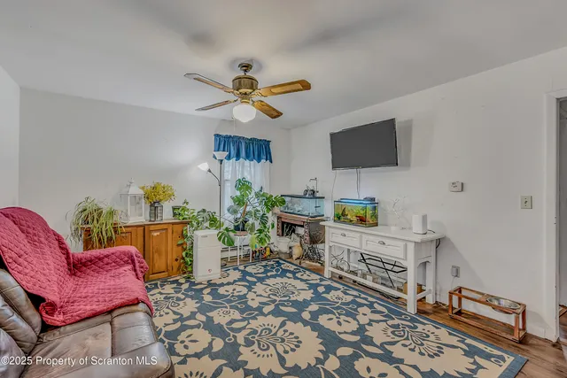 a kitchen with a refrigerator and white cabinets