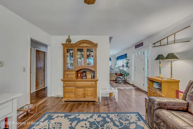 a very nice looking dining room with a large window and a chandelier