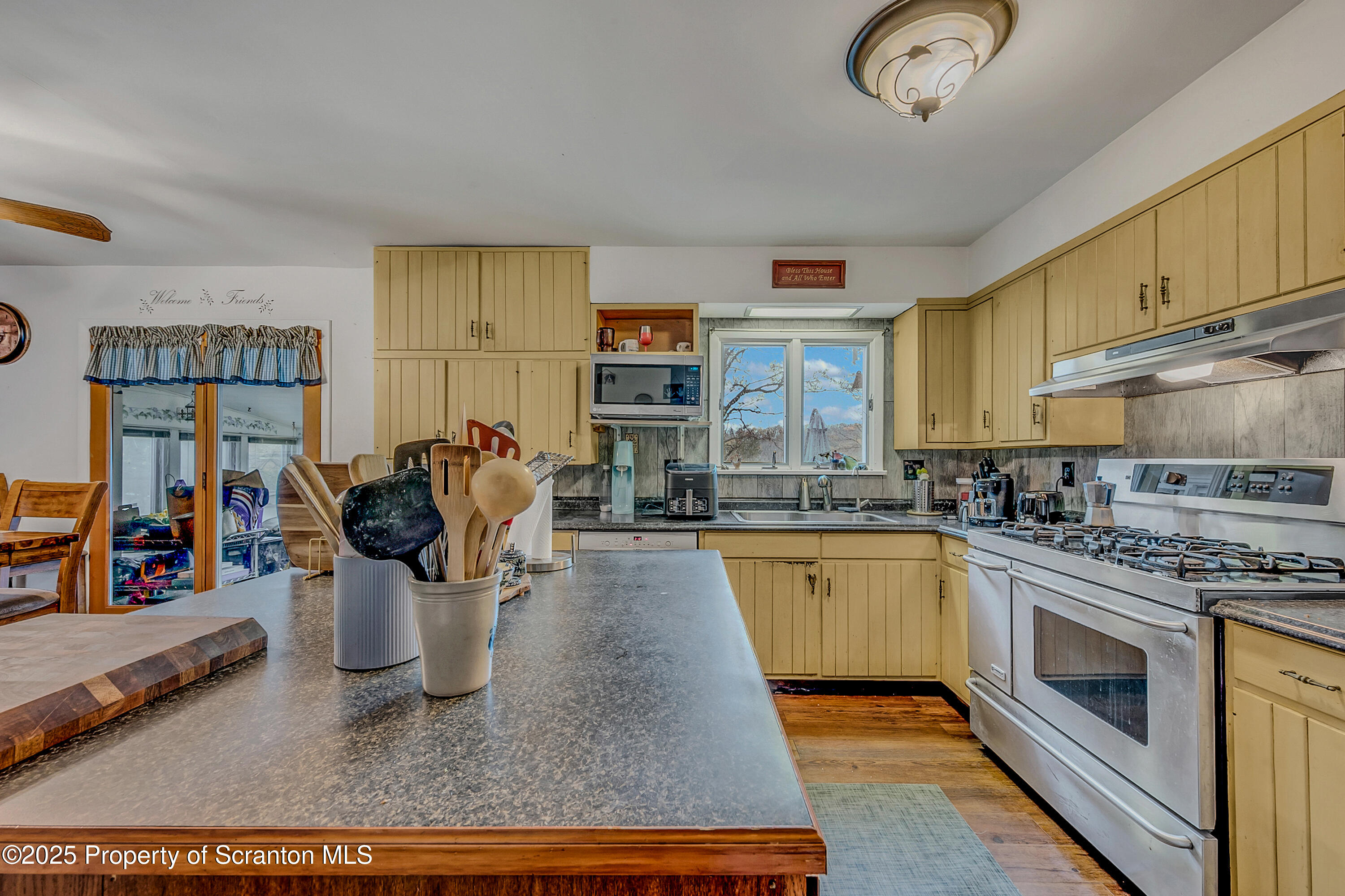 1001 Griggs Street Clarks Summit, PA 18411 - Photo 21 of 55 a kitchen with a refrigerator and white cabinets