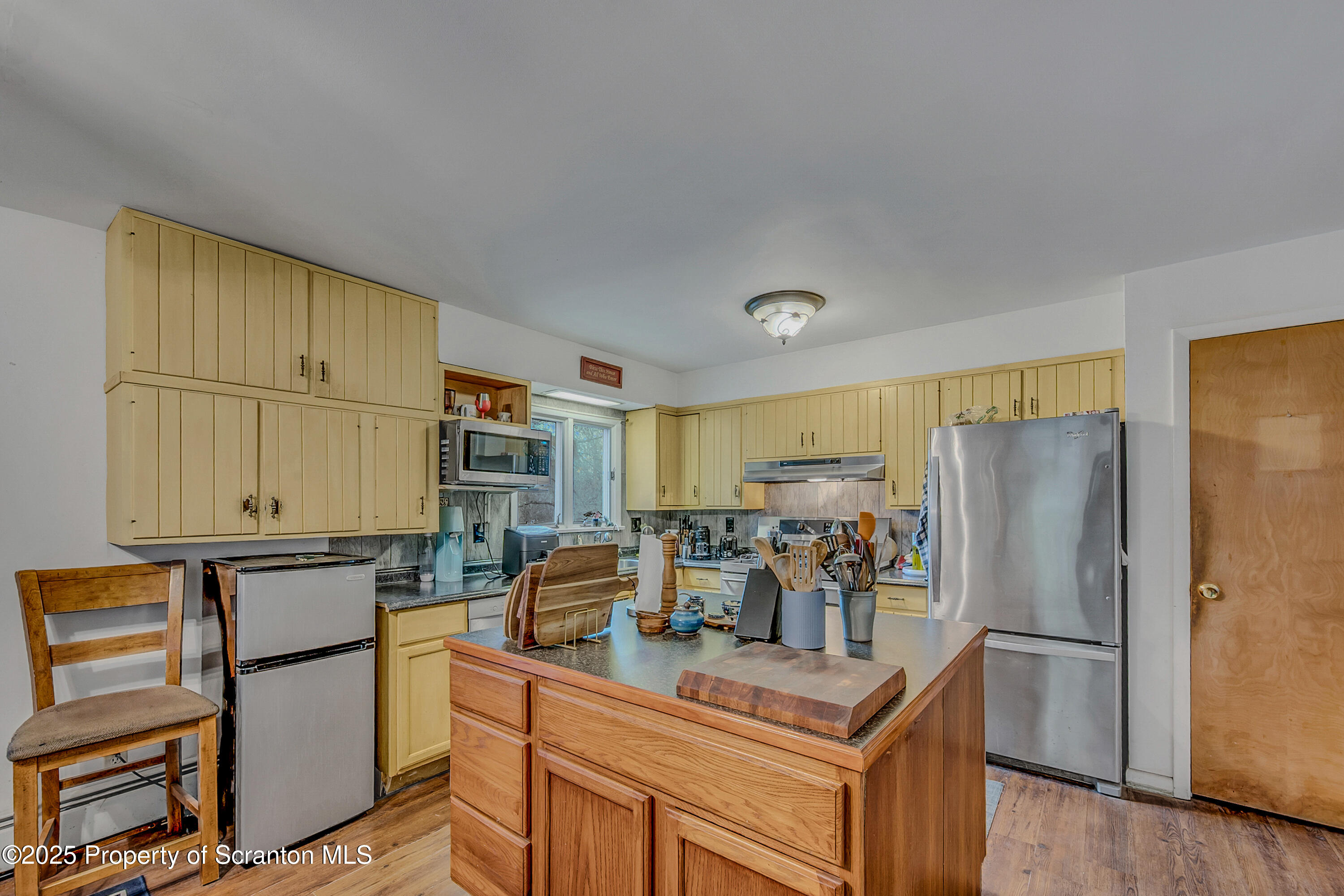 1001 Griggs Street Clarks Summit, PA 18411 - Photo 22 of 55 a kitchen with stainless steel appliances granite countertop a refrigerator and a stove