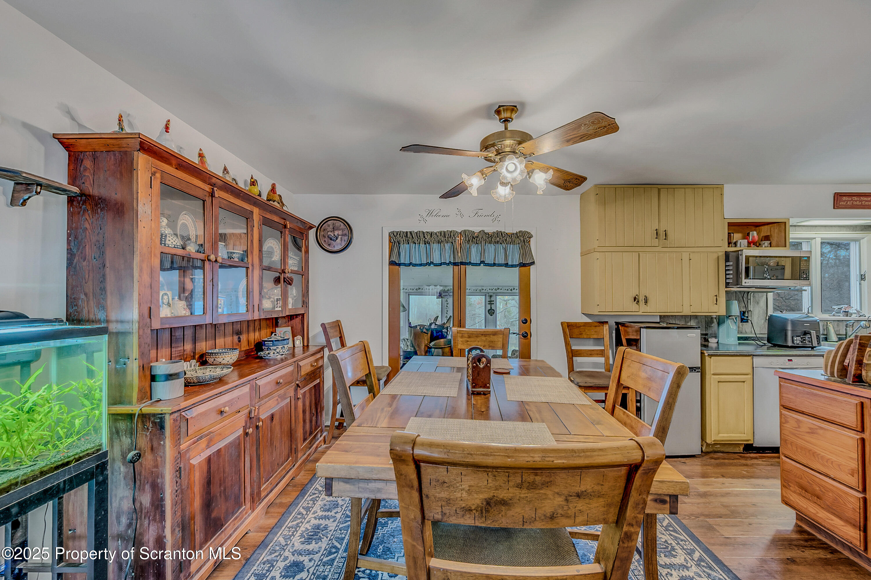 1001 Griggs Street Clarks Summit, PA 18411 - Photo 23 of 55 a very nice looking dining room with a large window and a chandelier