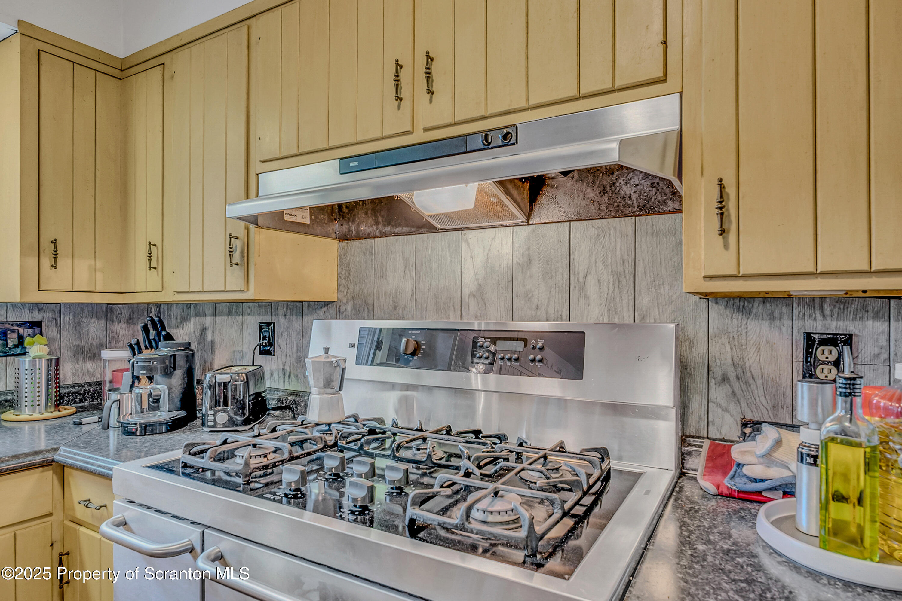 1001 Griggs Street Clarks Summit, PA 18411 - Photo 25 of 55 a kitchen with a stove and cabinets