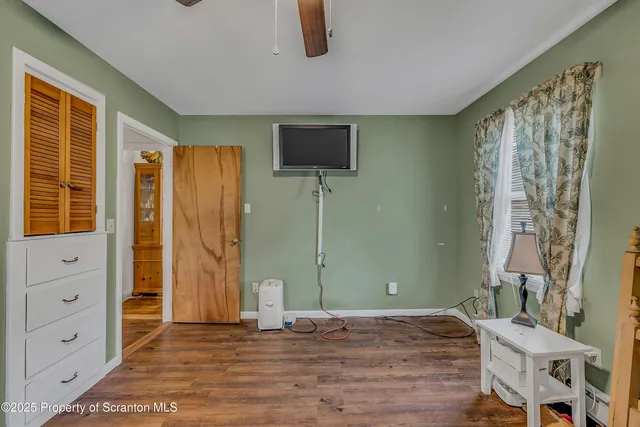a bedroom with a bed and dresser