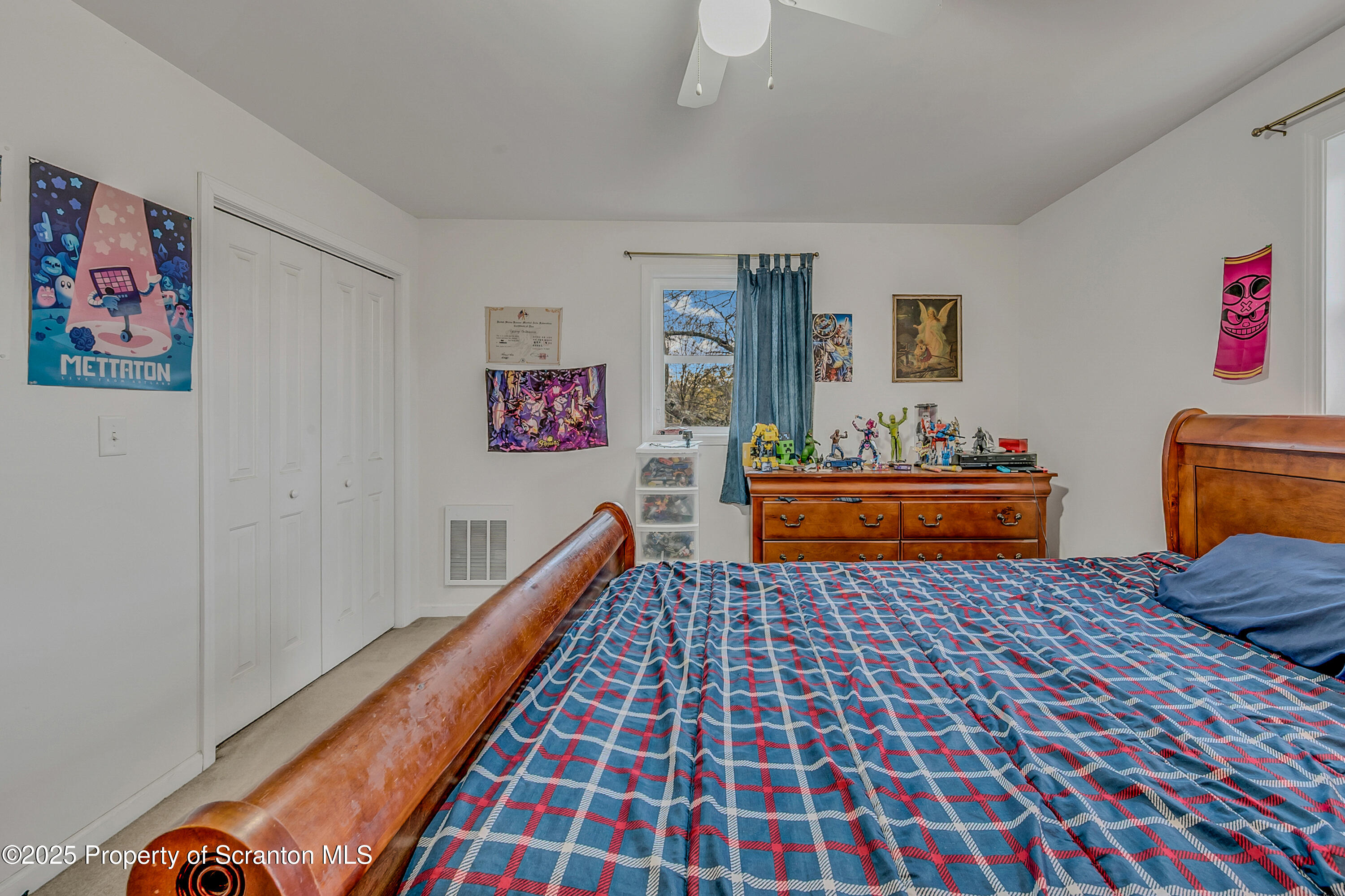 1001 Griggs Street Clarks Summit, PA 18411 - Photo 31 of 55 a bed room with a bed and a couch