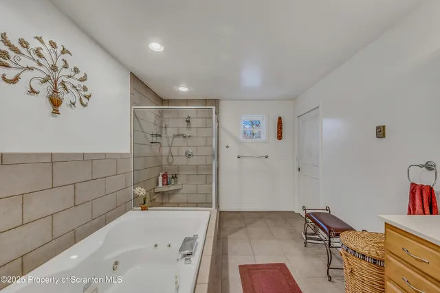 a view of a bedroom with a bed and a chandelier