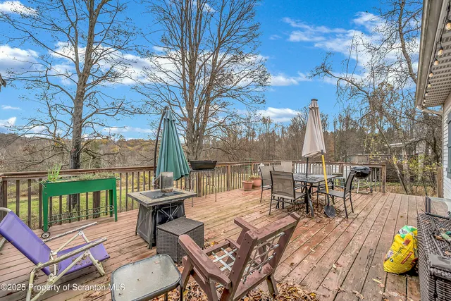 a view of a patio with iron fence