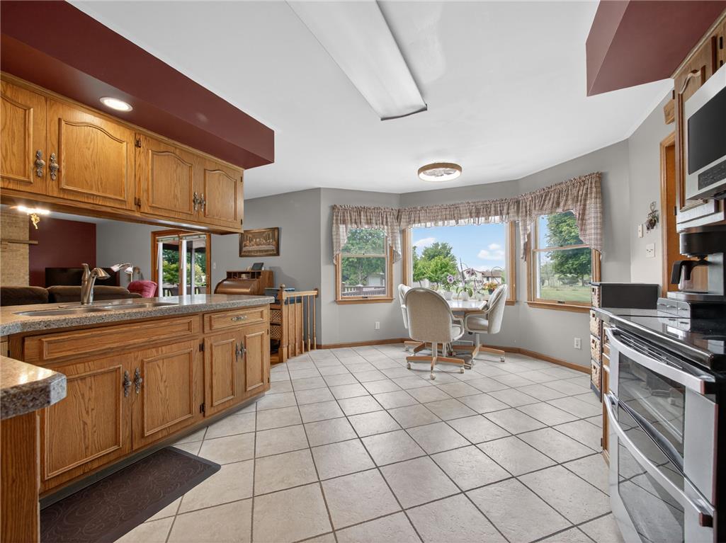 853 Lahr Road Nazareth, PA 18064 - Photo 11 of 29 A well-lit kitchen with granite counters and tiled flooring, offering a spacious eat-in area.