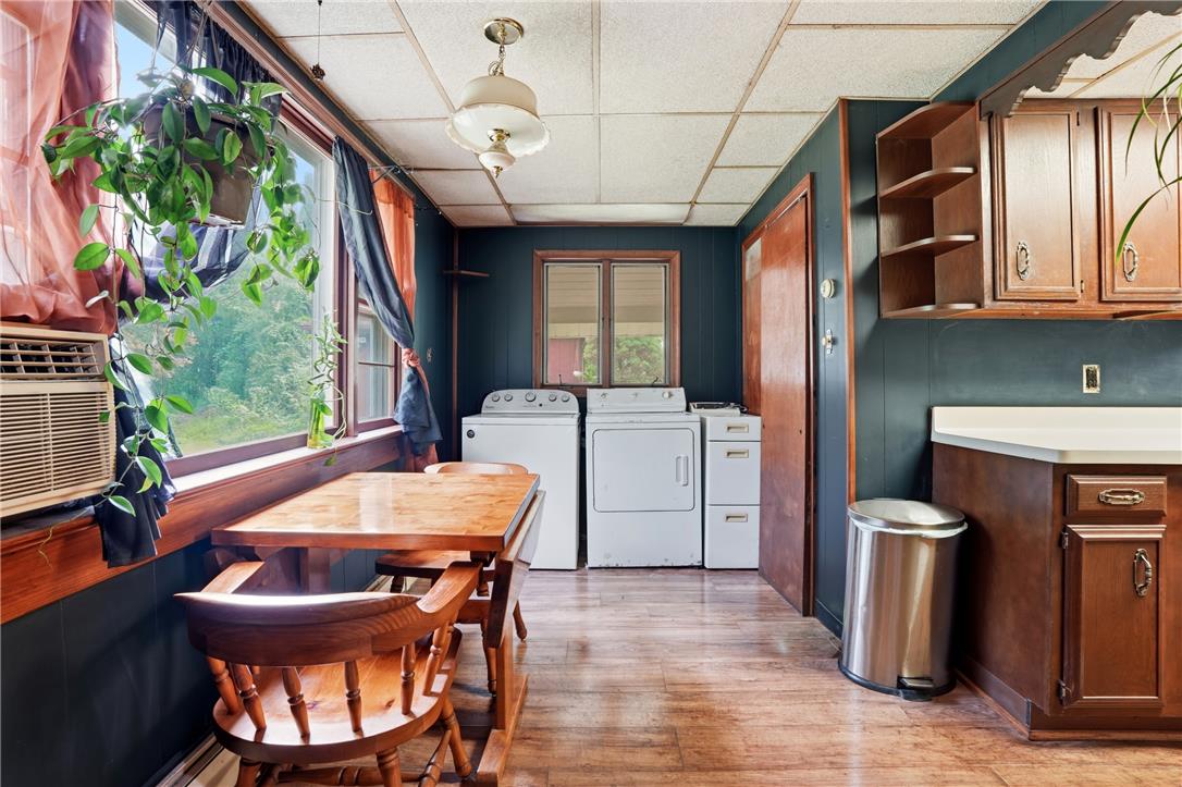 3573 Lower Saucon Road Hellertown, PA 18055 - Photo 11 of 56 Gleaming wood-look floors pair with classic cabinetry in this versatile utility and laundry zone.