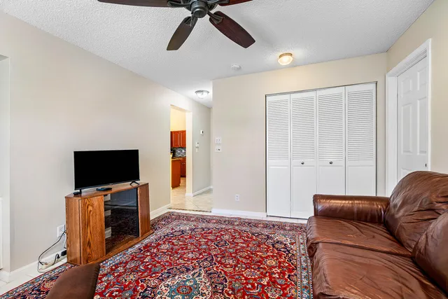 a living room with a couch and a flat screen tv
