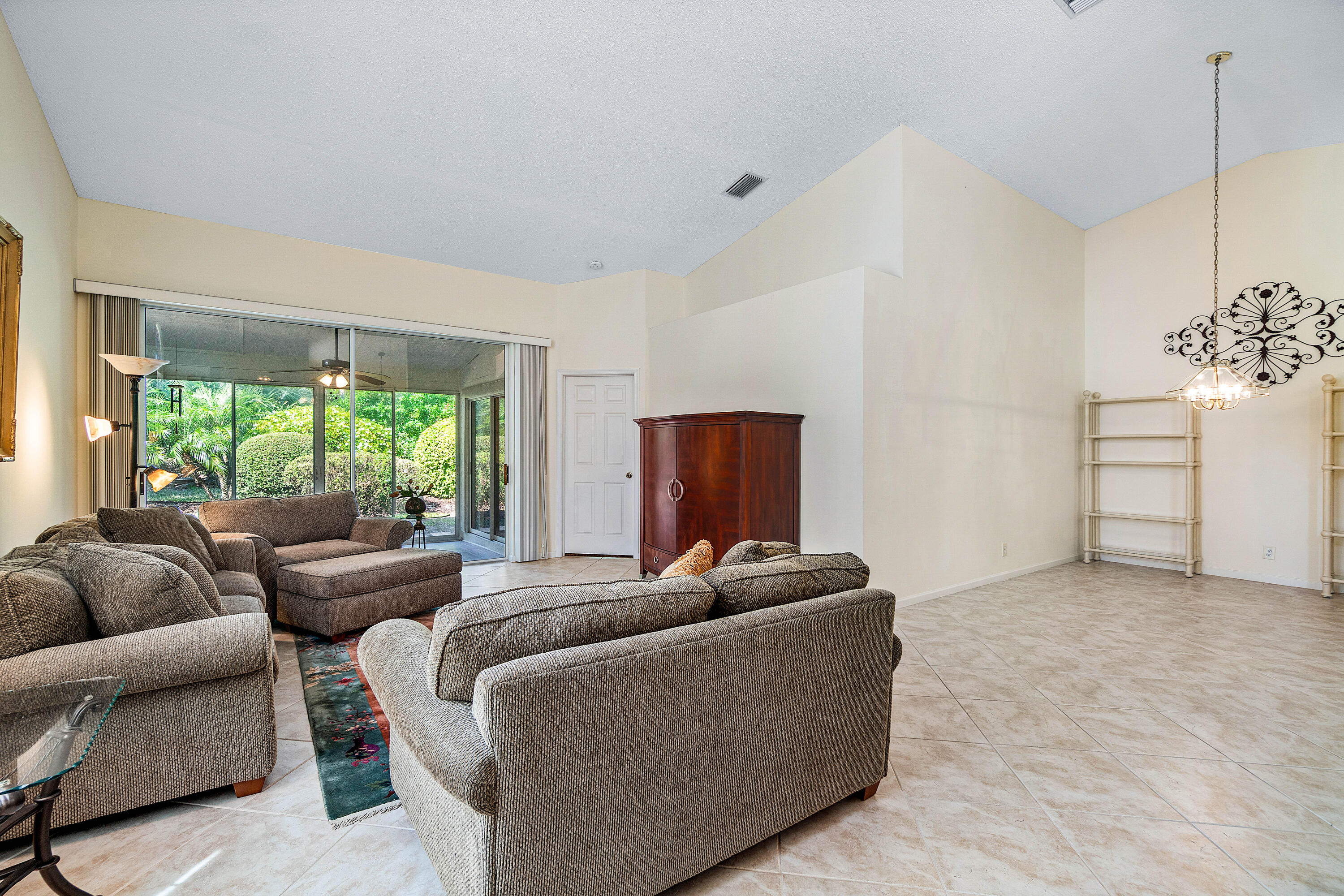 8918 Southeast Riverfront Terrace Jupiter, FL 33469 - Photo 5 of 43 a living room with furniture and a large window
