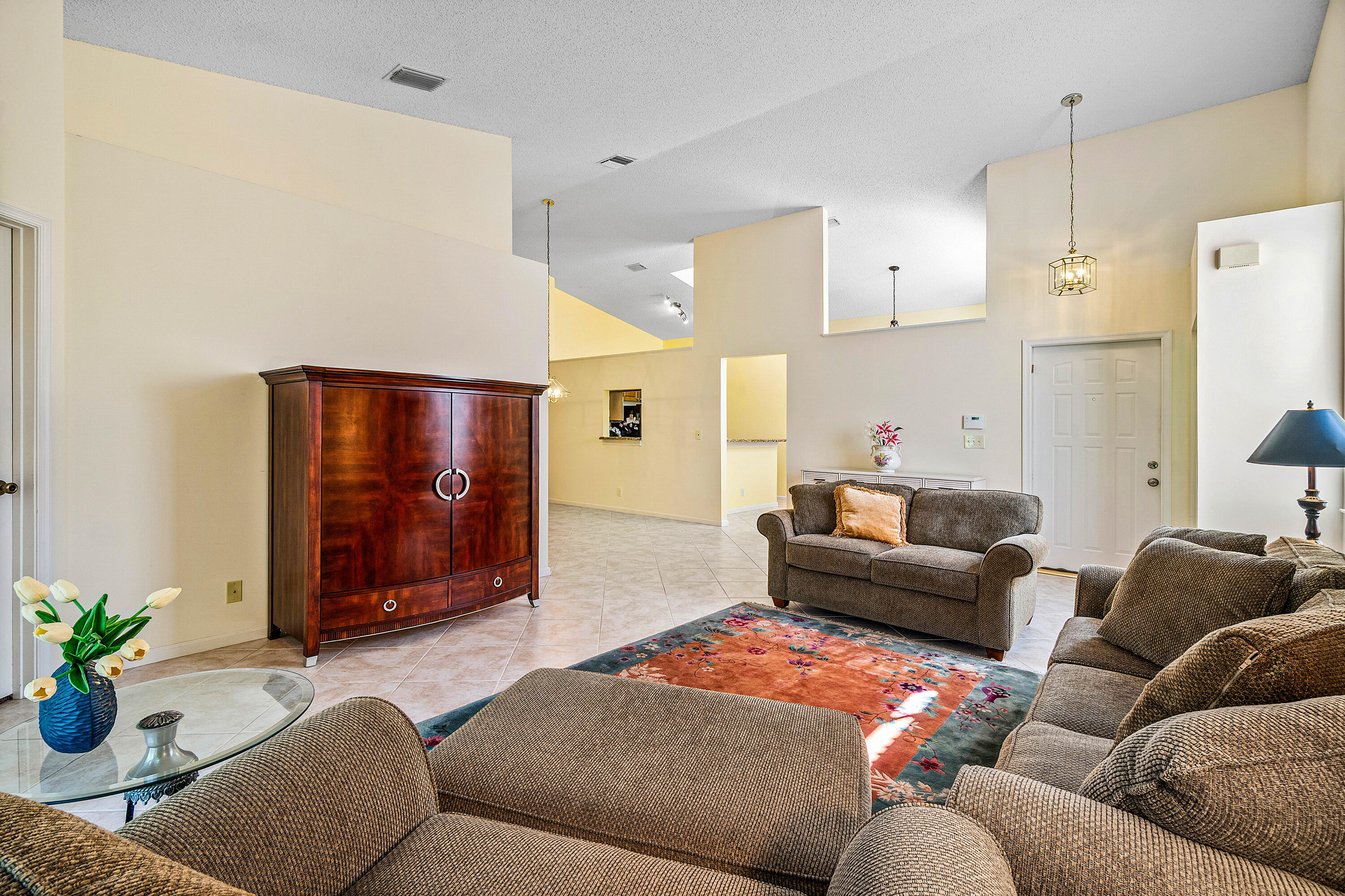 8918 Southeast Riverfront Terrace Jupiter, FL 33469 - Photo 8 of 43 a living room with furniture ceiling fan and a rug