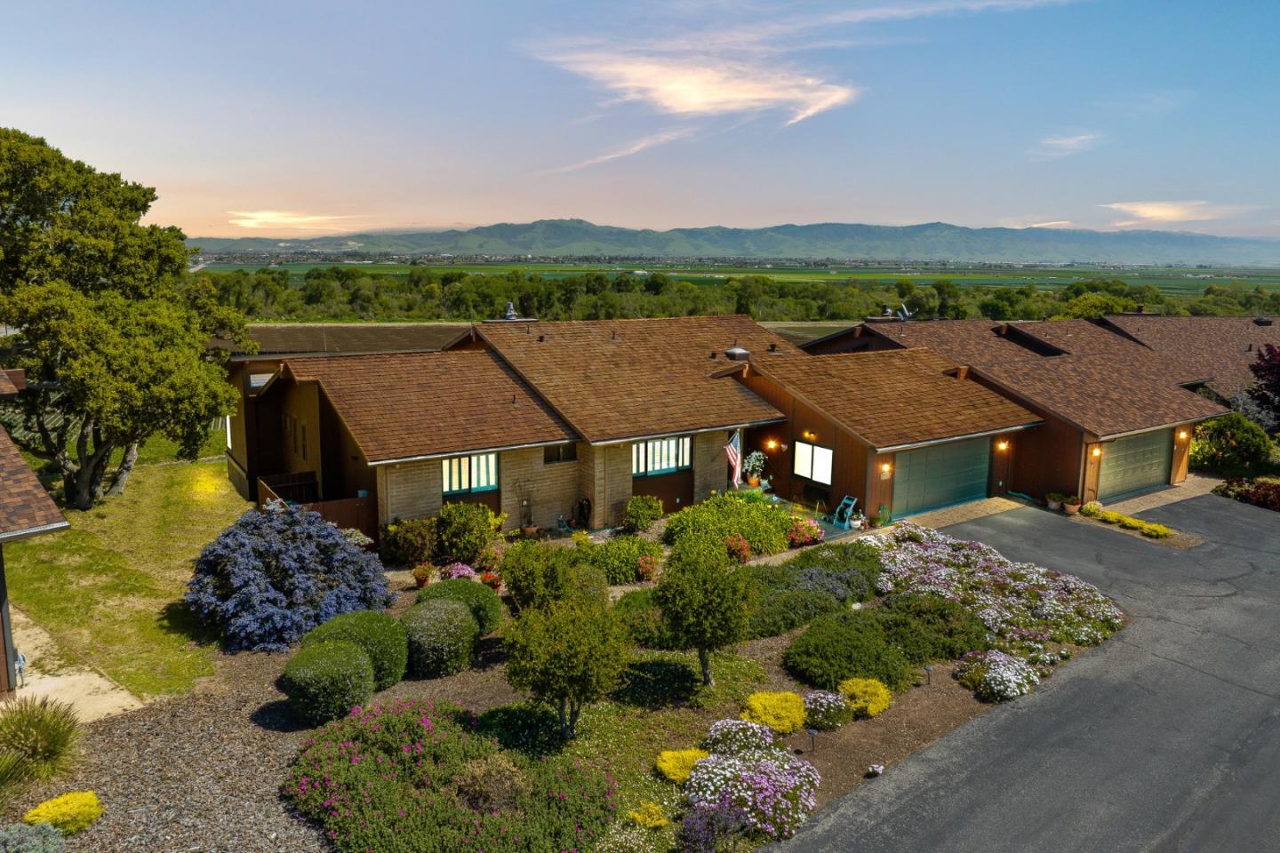 an aerial view of a house with a garden